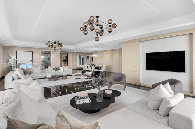 a living room with lots of furniture and a flat screen tv