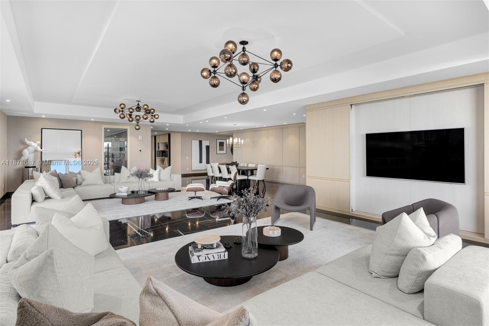 9349 Collins Avenue, Unit 406 Surfside, FL 33154 - Photo 7 of 48 a living room with lots of furniture and a flat screen tv