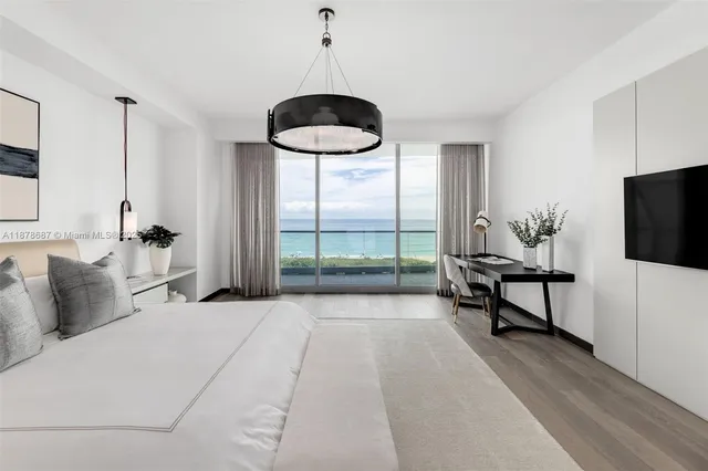 a bedroom with furniture and a window