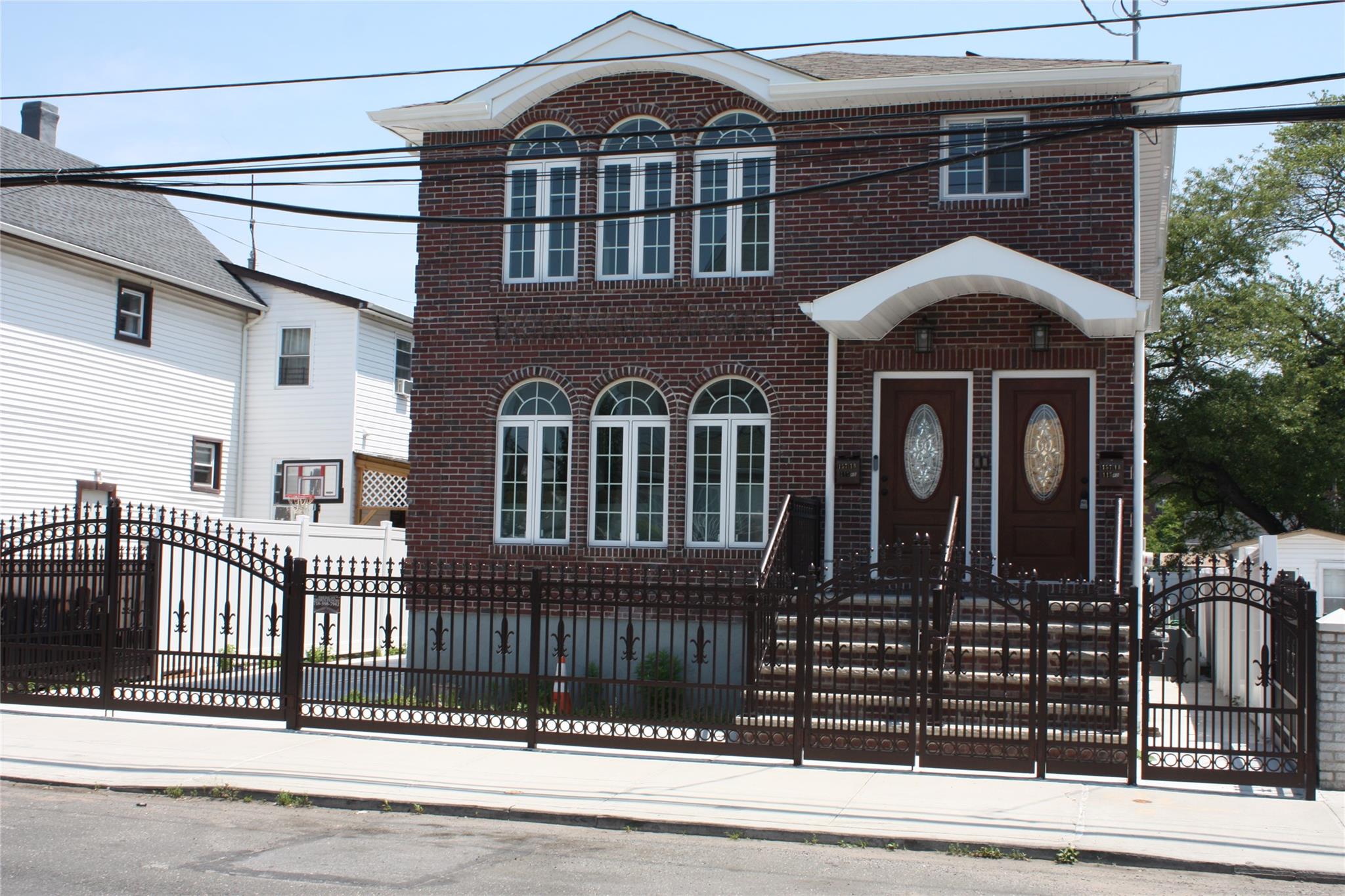 157-18 115th Road, Unit 2 FAMILY Queens, NY 11434 - Photo 15 of 36 a front view of a house