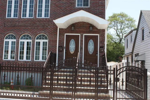a view of a balcony with wooden fence
