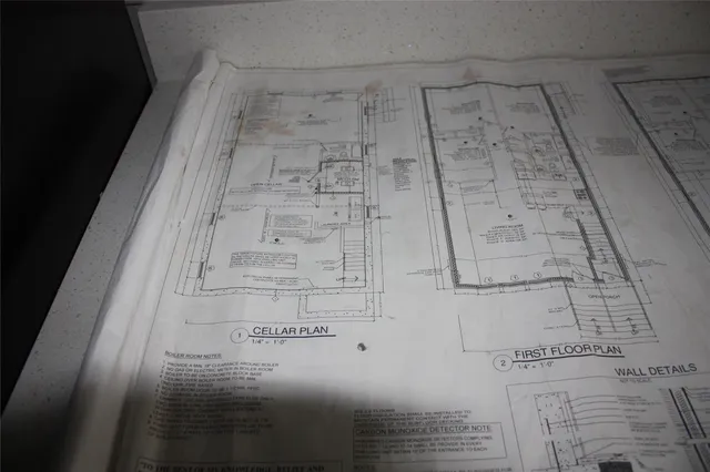 a front view of a house with a parking space