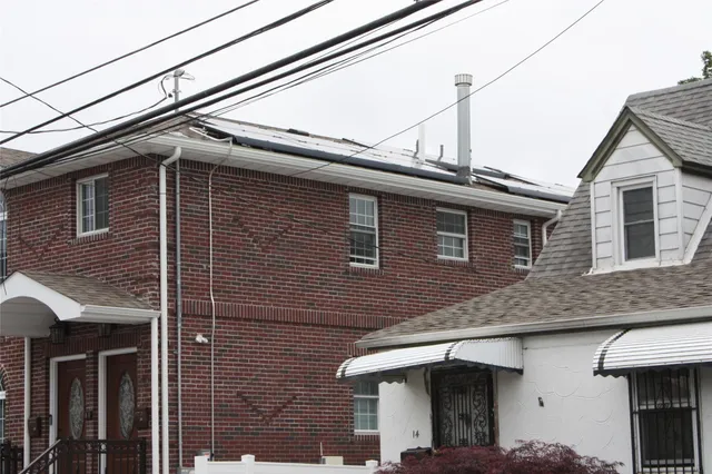 a view of a house with a roof deck