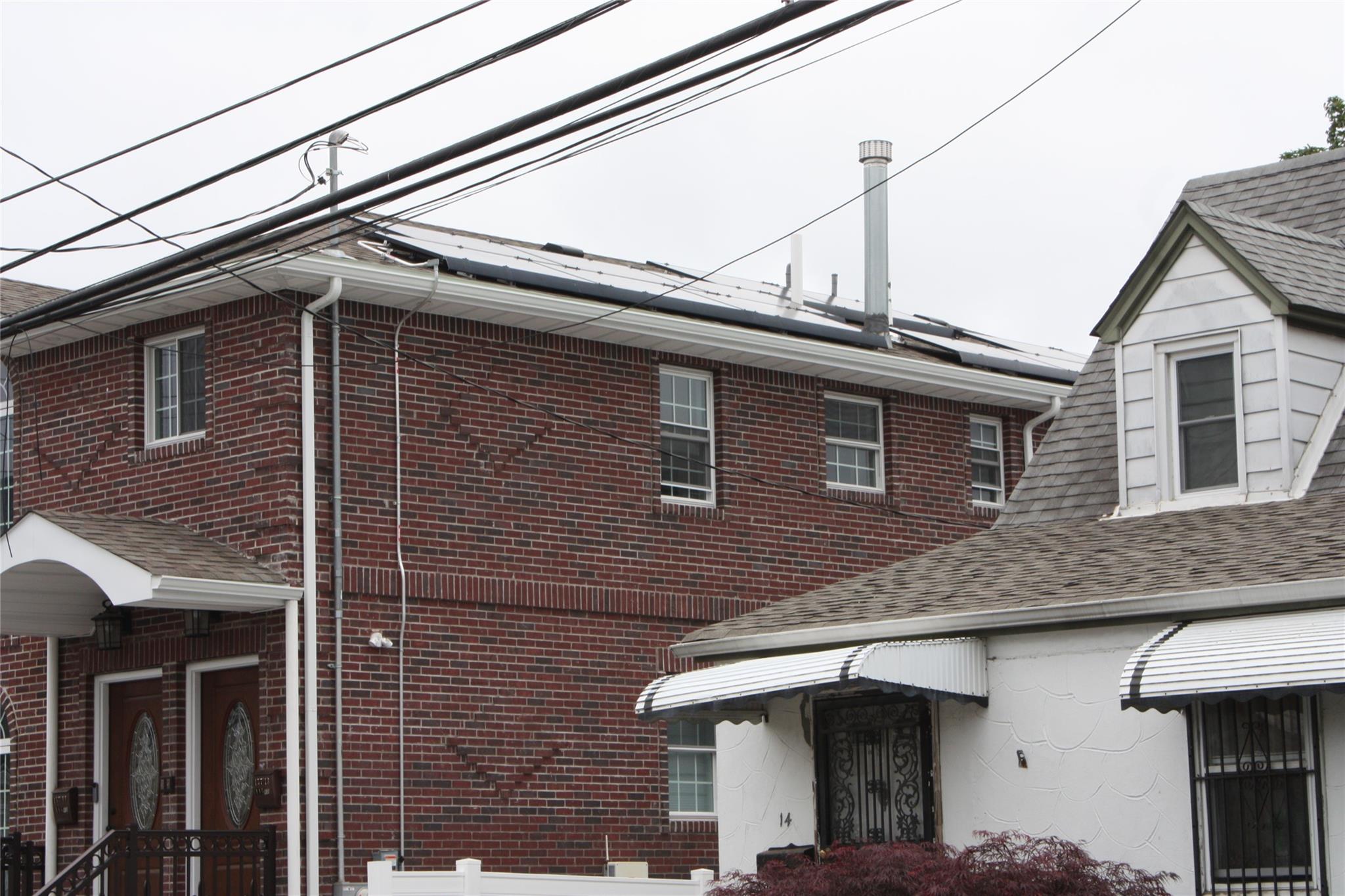 157-18 115th Road, Unit 2 FAMILY Queens, NY 11434 - Photo 2 of 36 a view of a house with a roof deck