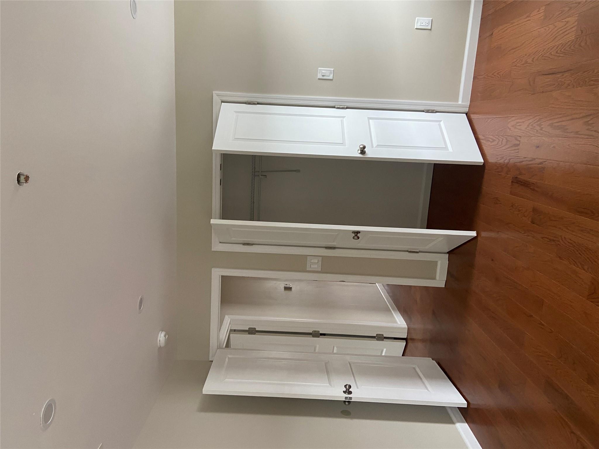 157-18 115th Road, Unit 2 FAMILY Queens, NY 11434 - Photo 32 of 36 a view of an empty room with wooden floor and closet