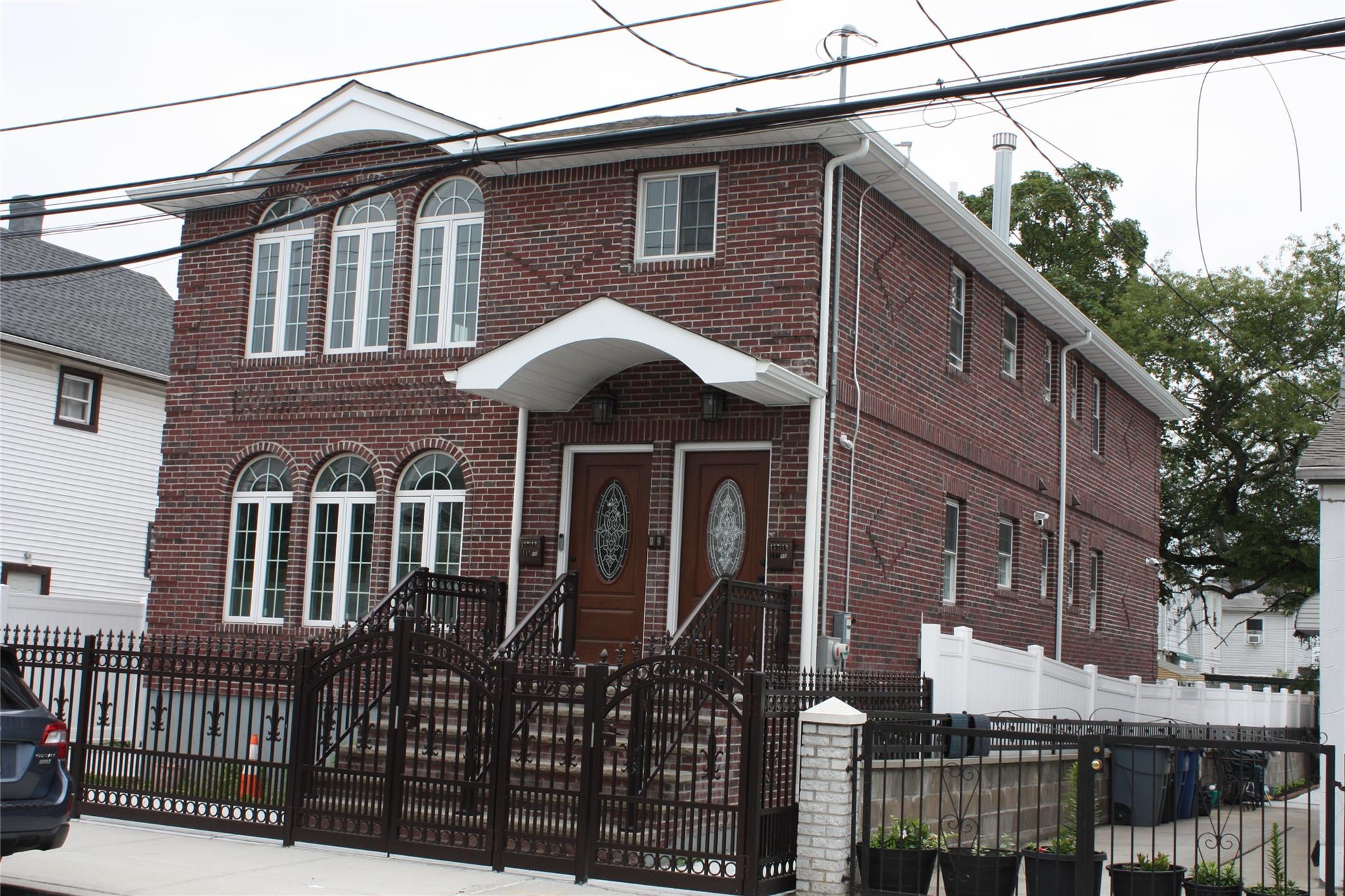 157-18 115th Road, Unit 2 FAMILY Queens, NY 11434 - Photo 4 of 36 a front view of a house with balcony