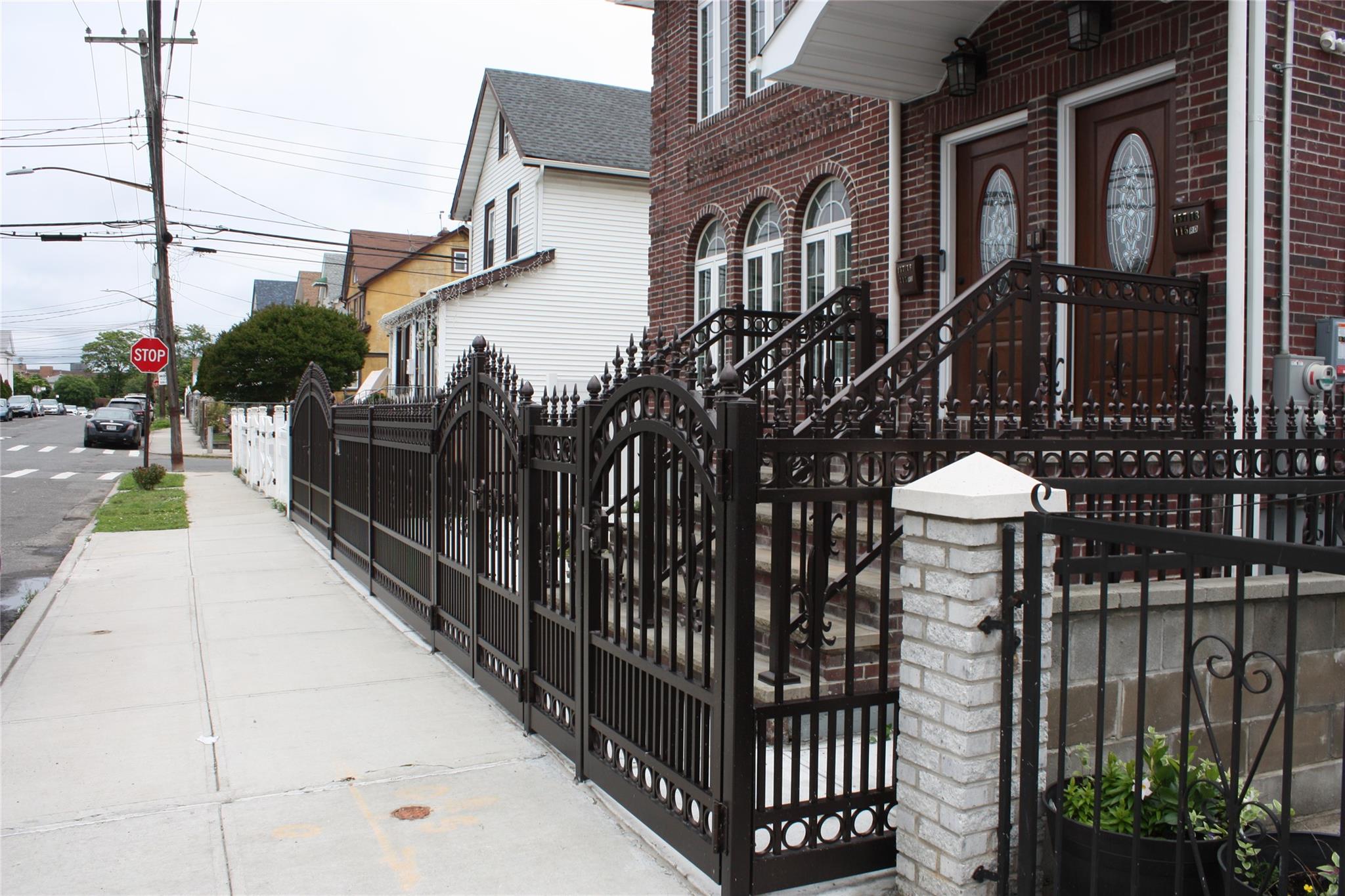 157-18 115th Road, Unit 2 FAMILY Queens, NY 11434 - Photo 5 of 36 a front view of a house with parking space