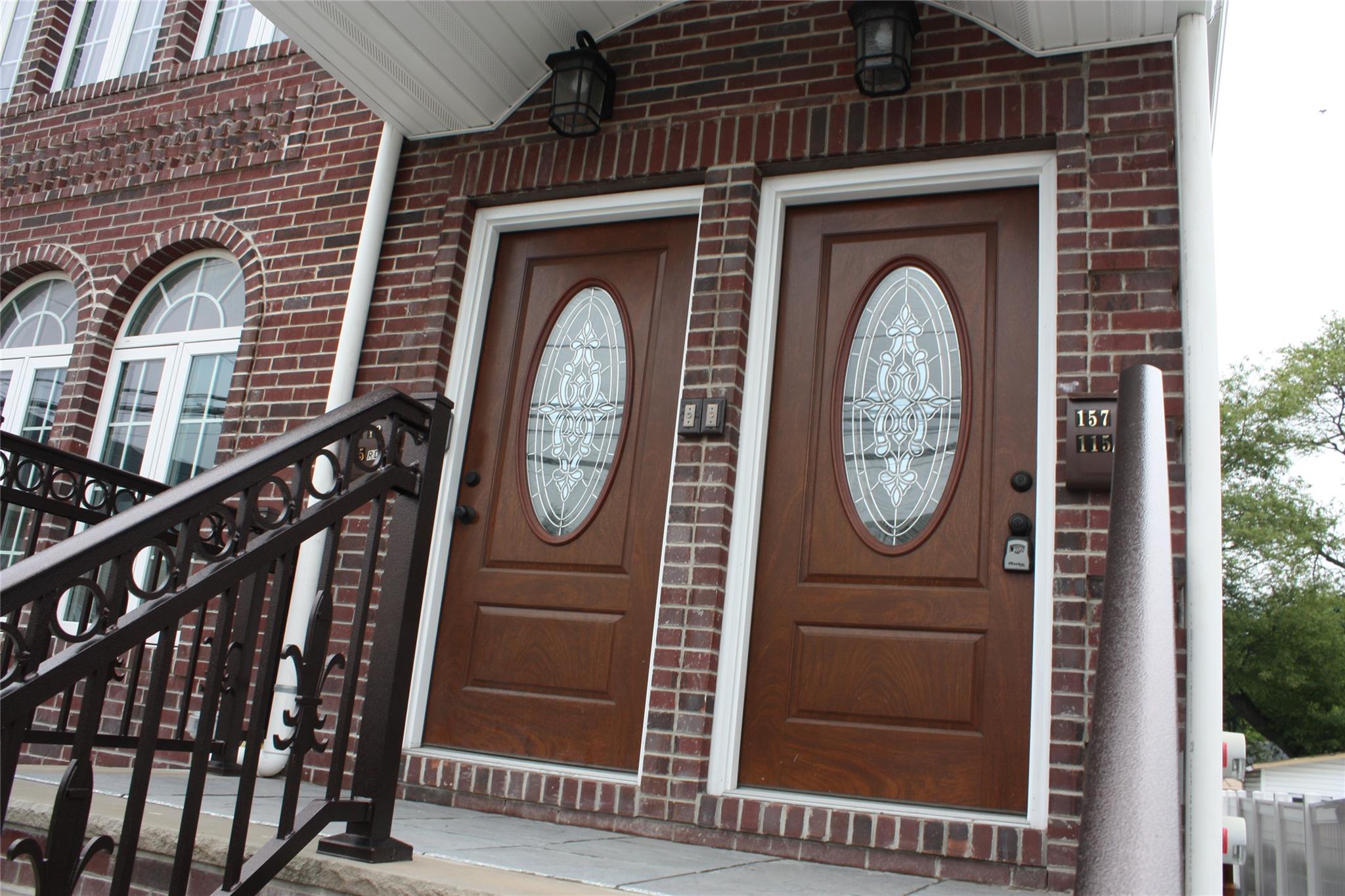 157-18 115th Road, Unit 2 FAMILY Queens, NY 11434 - Photo 7 of 36 a front view of a house with garden