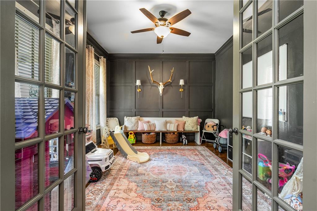 5605 Copper Creek Pass Cumming, GA 30040 - Photo 11 of 64 a living room with lots of furniture and a chandelier