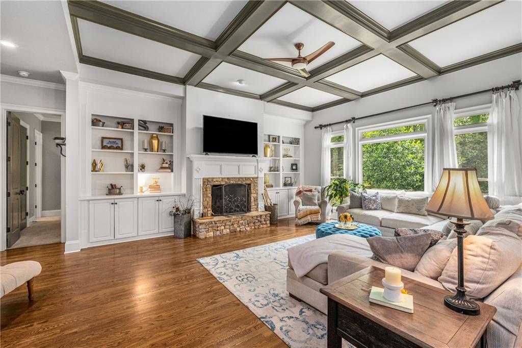 5605 Copper Creek Pass Cumming, GA 30040 - Photo 23 of 64 a living room with furniture fireplace and a large window