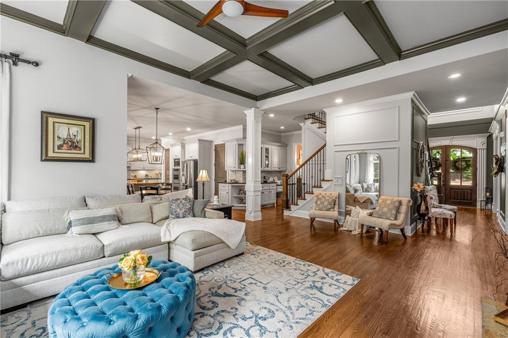 5605 Copper Creek Pass Cumming, GA 30040 - Photo 24 of 64 a living room with furniture and wooden floor