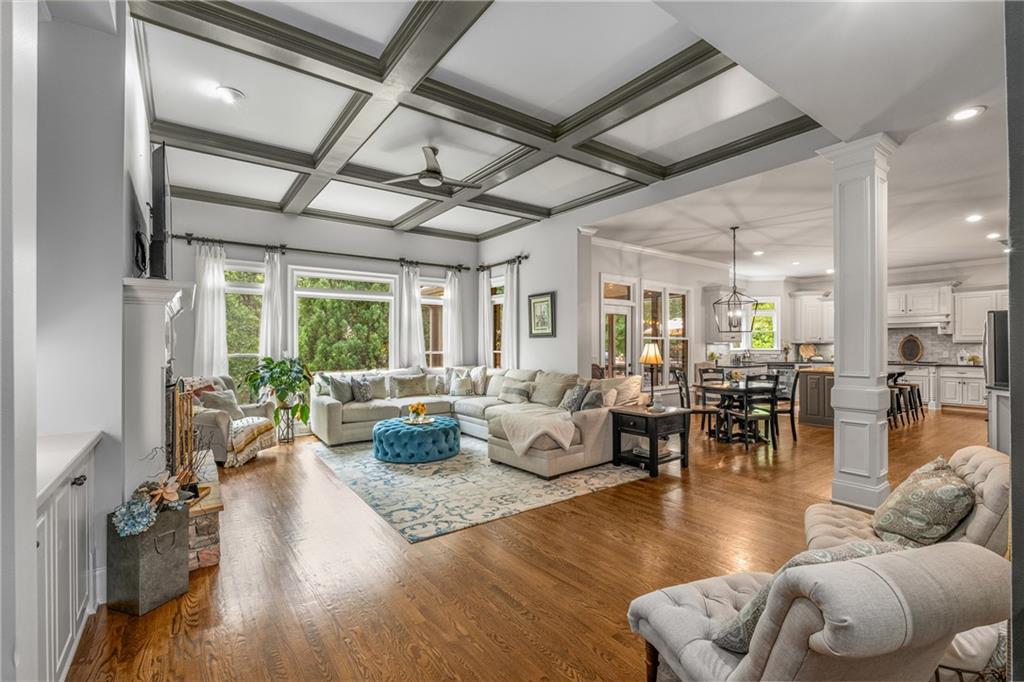 5605 Copper Creek Pass Cumming, GA 30040 - Photo 25 of 64 a living room with furniture and a large window