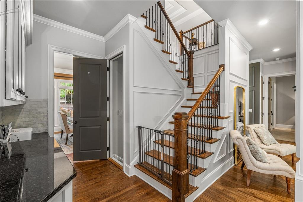 5605 Copper Creek Pass Cumming, GA 30040 - Photo 29 of 64 a view of entryway with wooden floor and stairs