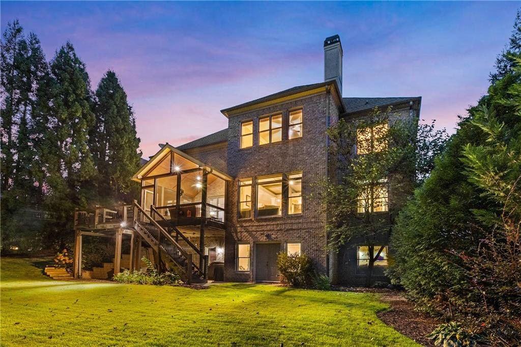 5605 Copper Creek Pass Cumming, GA 30040 - Photo 3 of 64 a front view of a house with a yard