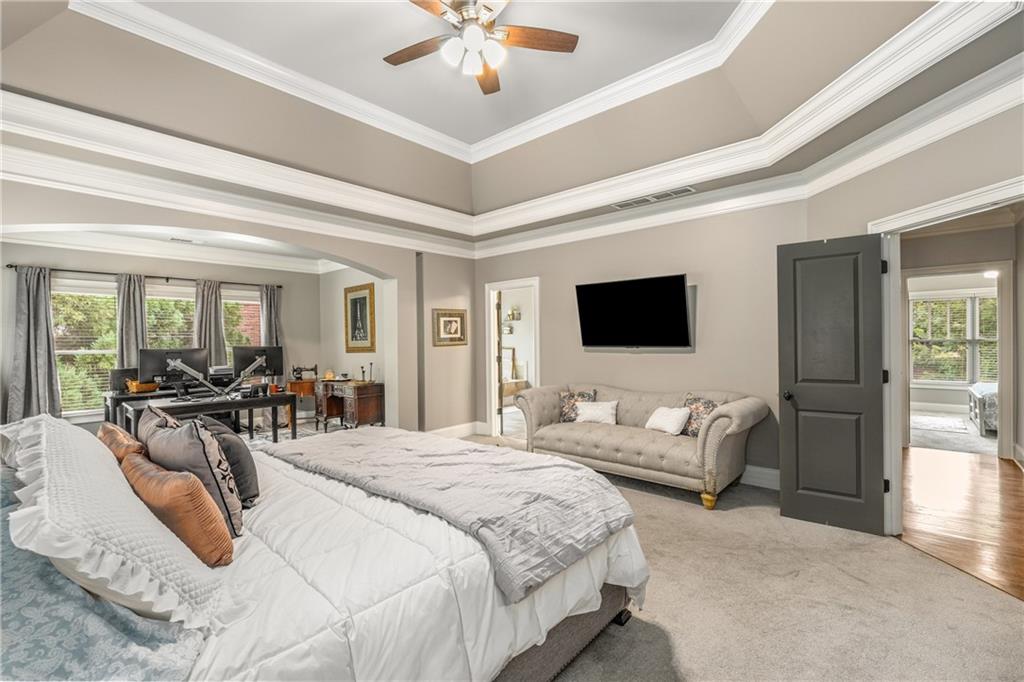 5605 Copper Creek Pass Cumming, GA 30040 - Photo 32 of 64 a bedroom with bed and flat screen tv