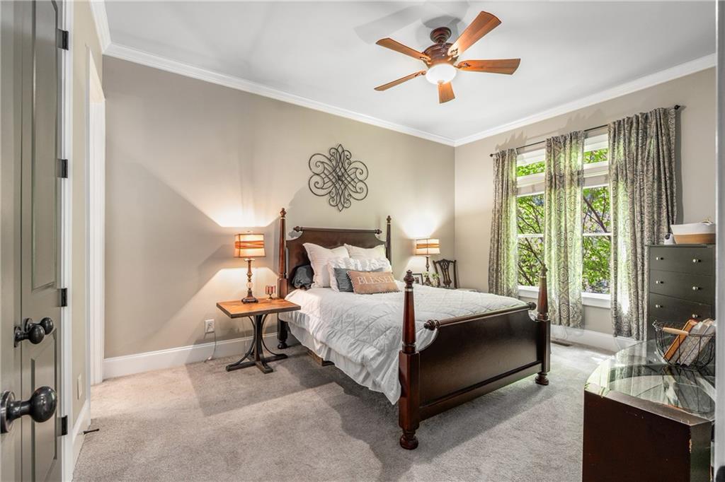 5605 Copper Creek Pass Cumming, GA 30040 - Photo 35 of 64 a bedroom with a bed and a large window