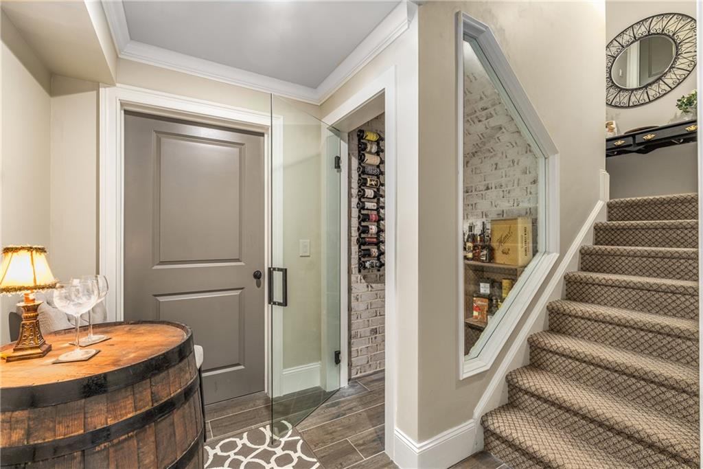 5605 Copper Creek Pass Cumming, GA 30040 - Photo 44 of 64 a bathroom with a granite countertop sink and a mirror