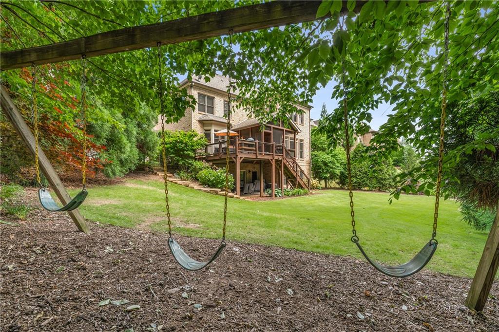 5605 Copper Creek Pass Cumming, GA 30040 - Photo 54 of 64 a view of a park with a slide