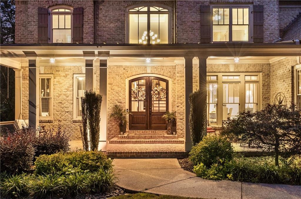 5605 Copper Creek Pass Cumming, GA 30040 - Photo 55 of 64 a front view of a building with a outdoor shower