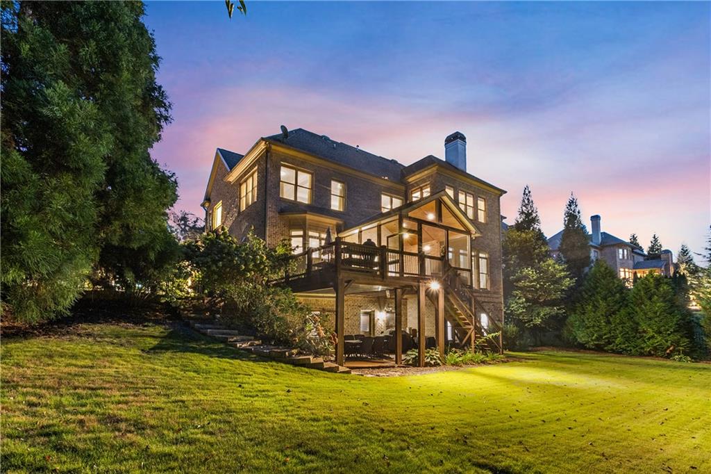 5605 Copper Creek Pass Cumming, GA 30040 - Photo 56 of 64 a front view of a house with a yard