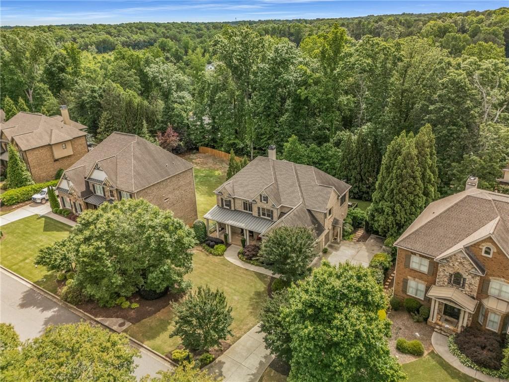 5605 Copper Creek Pass Cumming, GA 30040 - Photo 61 of 64 an aerial view of a house with a yard