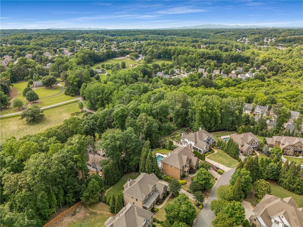 5605 Copper Creek Pass Cumming, GA 30040 - Photo 62 of 64 an aerial view of a house with a yard