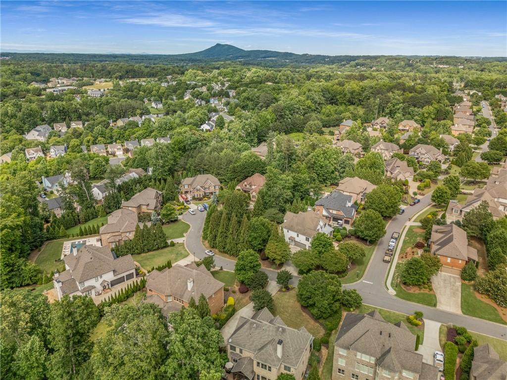 5605 Copper Creek Pass Cumming, GA 30040 - Photo 63 of 64 an aerial view of residential houses with outdoor space and trees