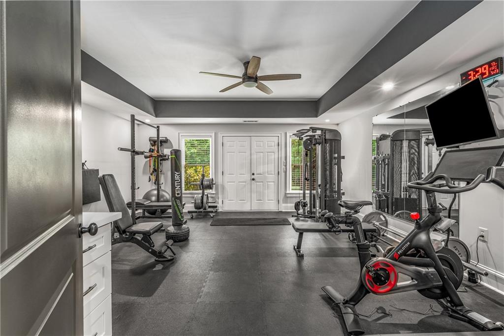5605 Copper Creek Pass Cumming, GA 30040 - Photo 8 of 64 a view of a room with gym equipment