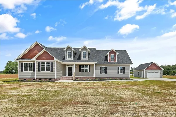 a front view of a house with a yard
