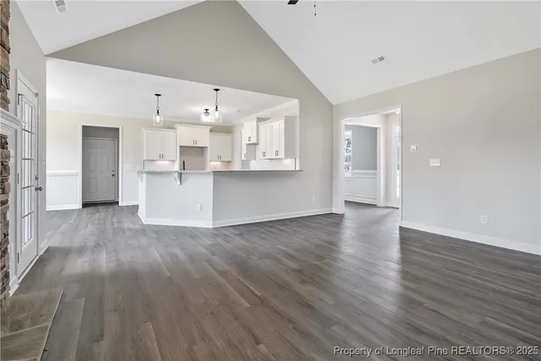 a view of kitchen and wooden floor