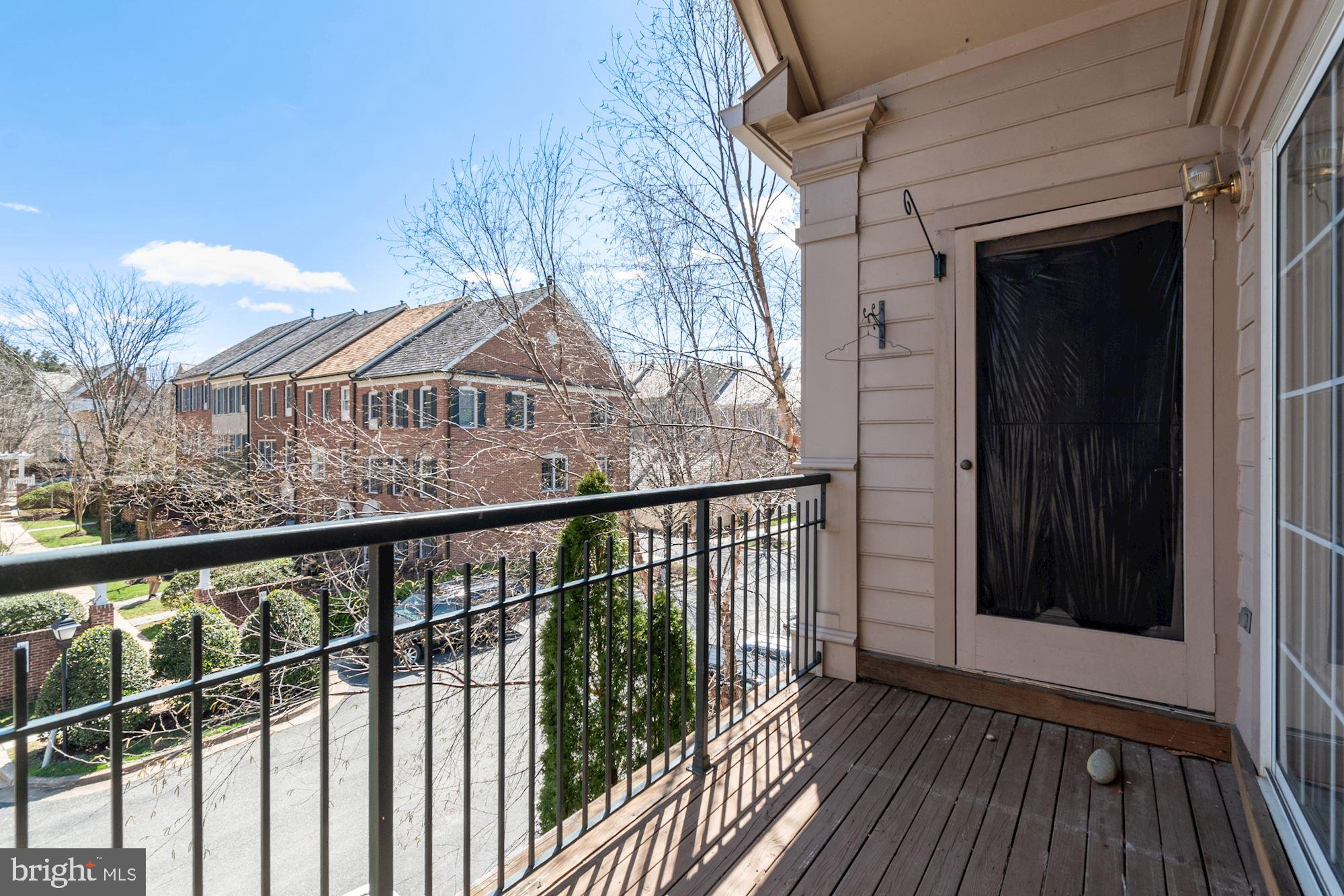 304 Ridgepoint Place, Unit 32 Gaithersburg, MD 20878 - Photo 10 of 28 a view of a balcony with wooden floor