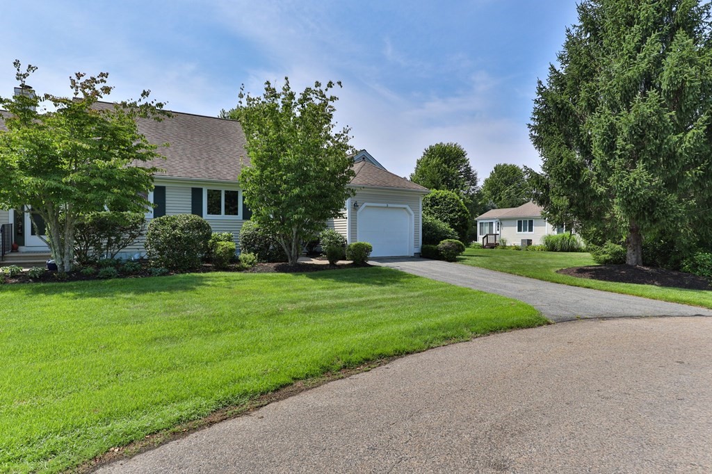 5 Woods Edge Lane, Unit 5 Mashpee, MA 02649 - Photo 1 of 29 a front view of house with yard and green space