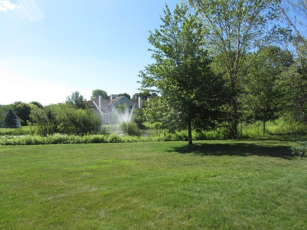5 Woods Edge Lane, Unit 5 Mashpee, MA 02649 - Photo 22 of 29 a view of a grassy field