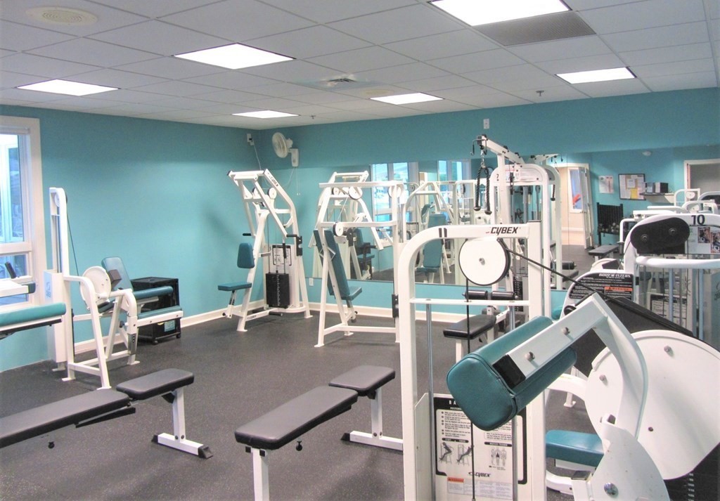 5 Woods Edge Lane, Unit 5 Mashpee, MA 02649 - Photo 27 of 29 a view of a room with gym equipment