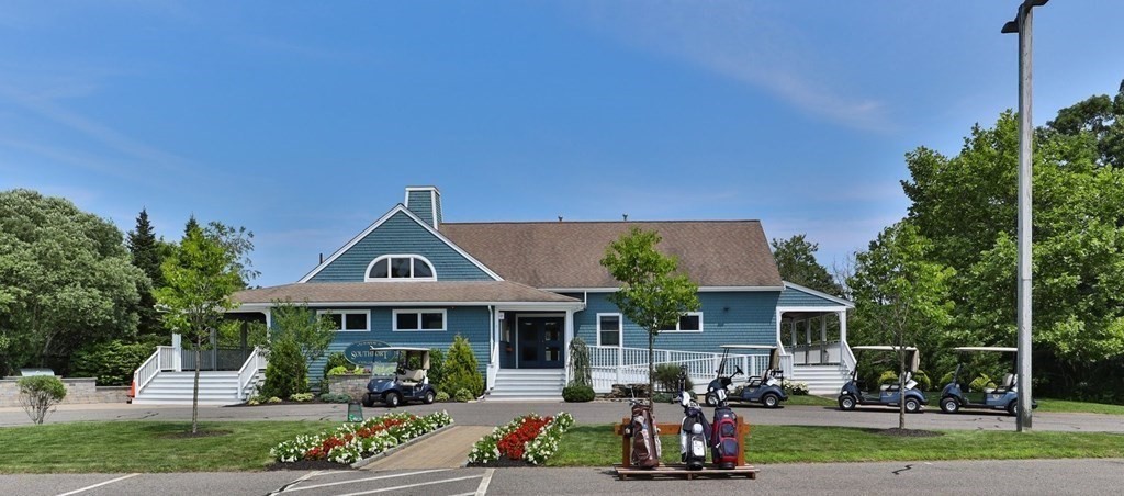 5 Woods Edge Lane, Unit 5 Mashpee, MA 02649 - Photo 29 of 29 a front view of a house with garden