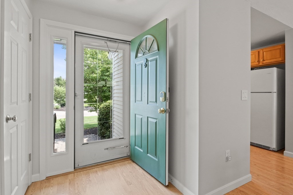 5 Woods Edge Lane, Unit 5 Mashpee, MA 02649 - Photo 3 of 29 a view of an entryway with wooden floor