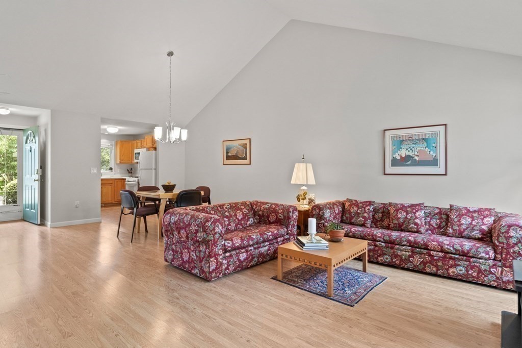 5 Woods Edge Lane, Unit 5 Mashpee, MA 02649 - Photo 5 of 29 a living room with furniture and a wooden floor