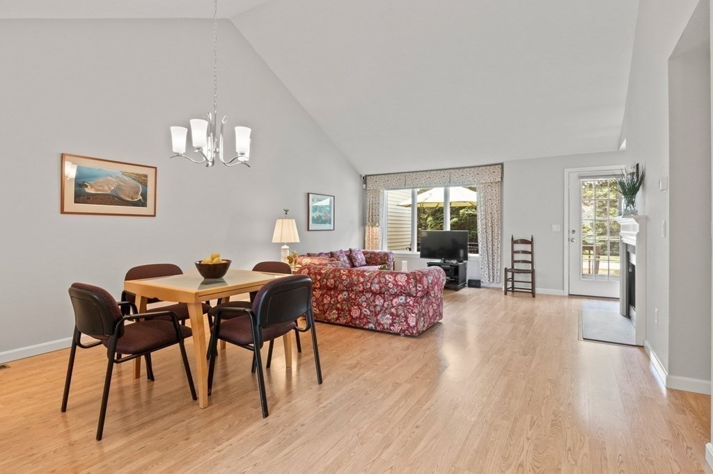 5 Woods Edge Lane, Unit 5 Mashpee, MA 02649 - Photo 8 of 29 a living room with furniture and wooden floor