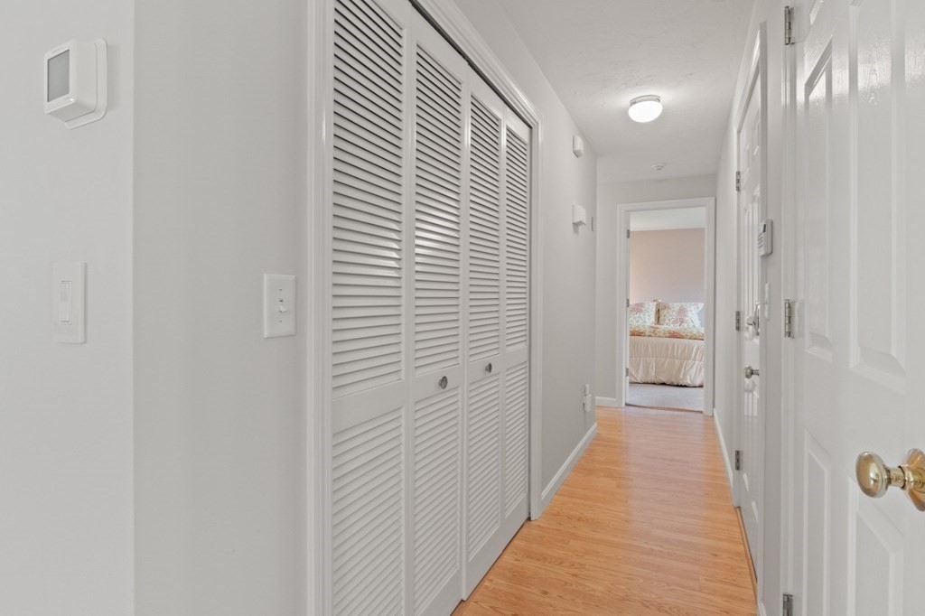 5 Woods Edge Lane, Unit 5 Mashpee, MA 02649 - Photo 10 of 29 a view of a bathroom from the hallway