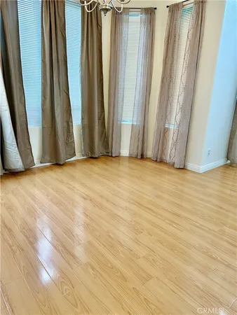 a view of wooden floor and chairs