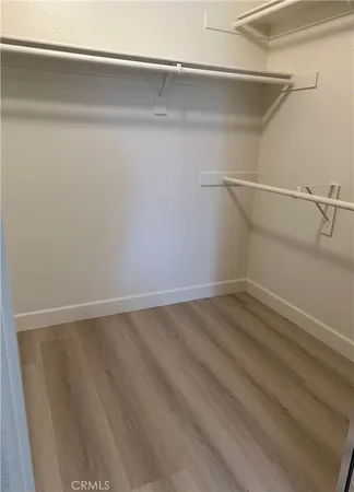 a view of an empty walk in closet