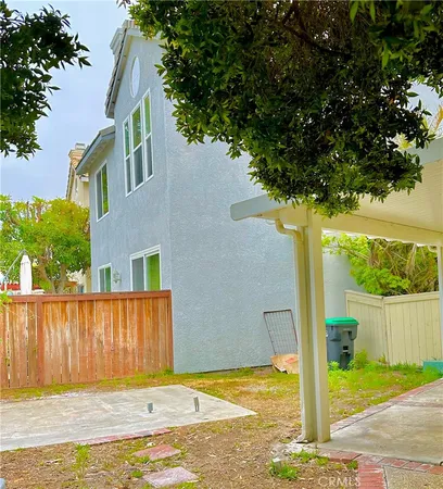 a view of a house with a small yard