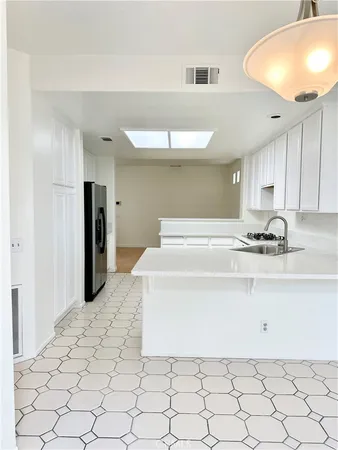 a bedroom with a bed and a lamp