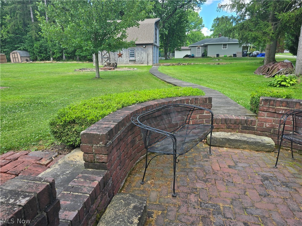 285 North Turner Road Youngstown, OH 44515 - Photo 9 of 33 Brick patio and barn in backyard