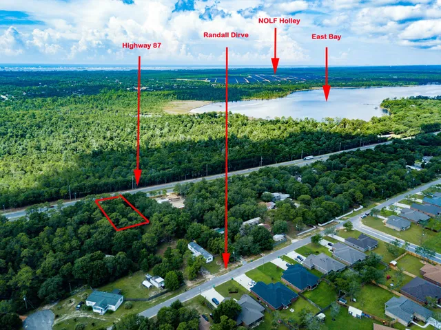 a view of street with houses and a yard