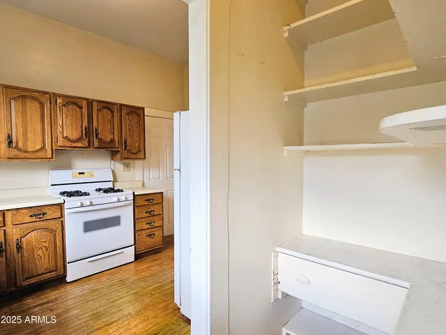 a kitchen with stainless steel appliances a stove and a refrigerator