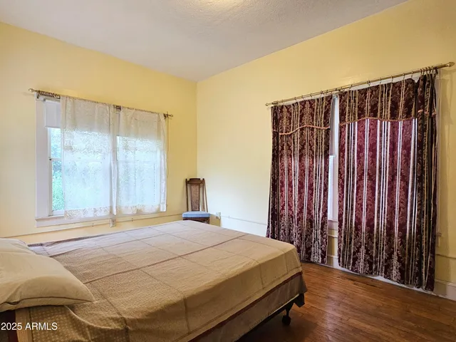 a bedroom with a bed and a closet