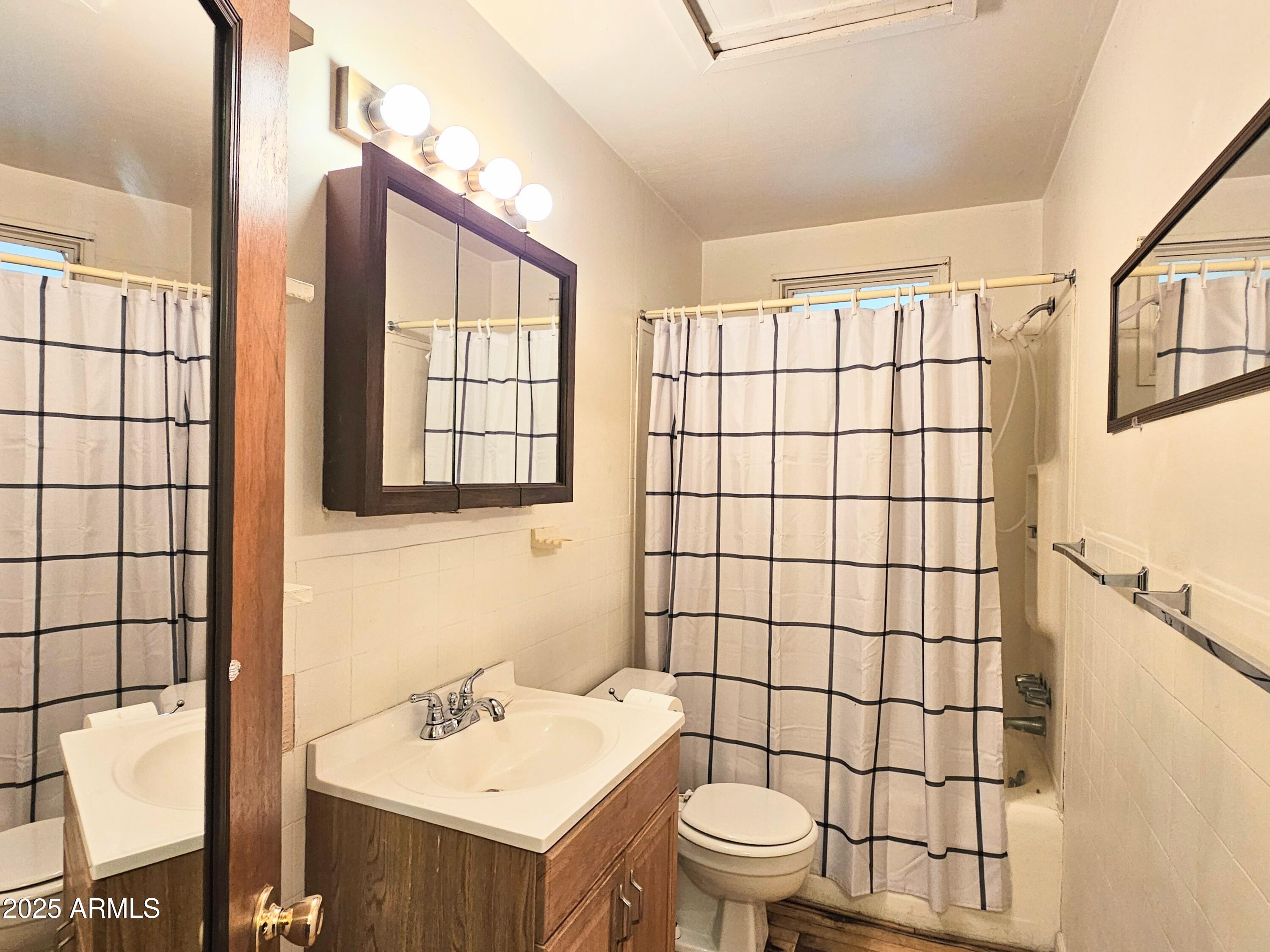 164 Quality Hill Road Bisbee, AZ 85603 - Photo 18 of 36 a bathroom with a sink toilet and shower