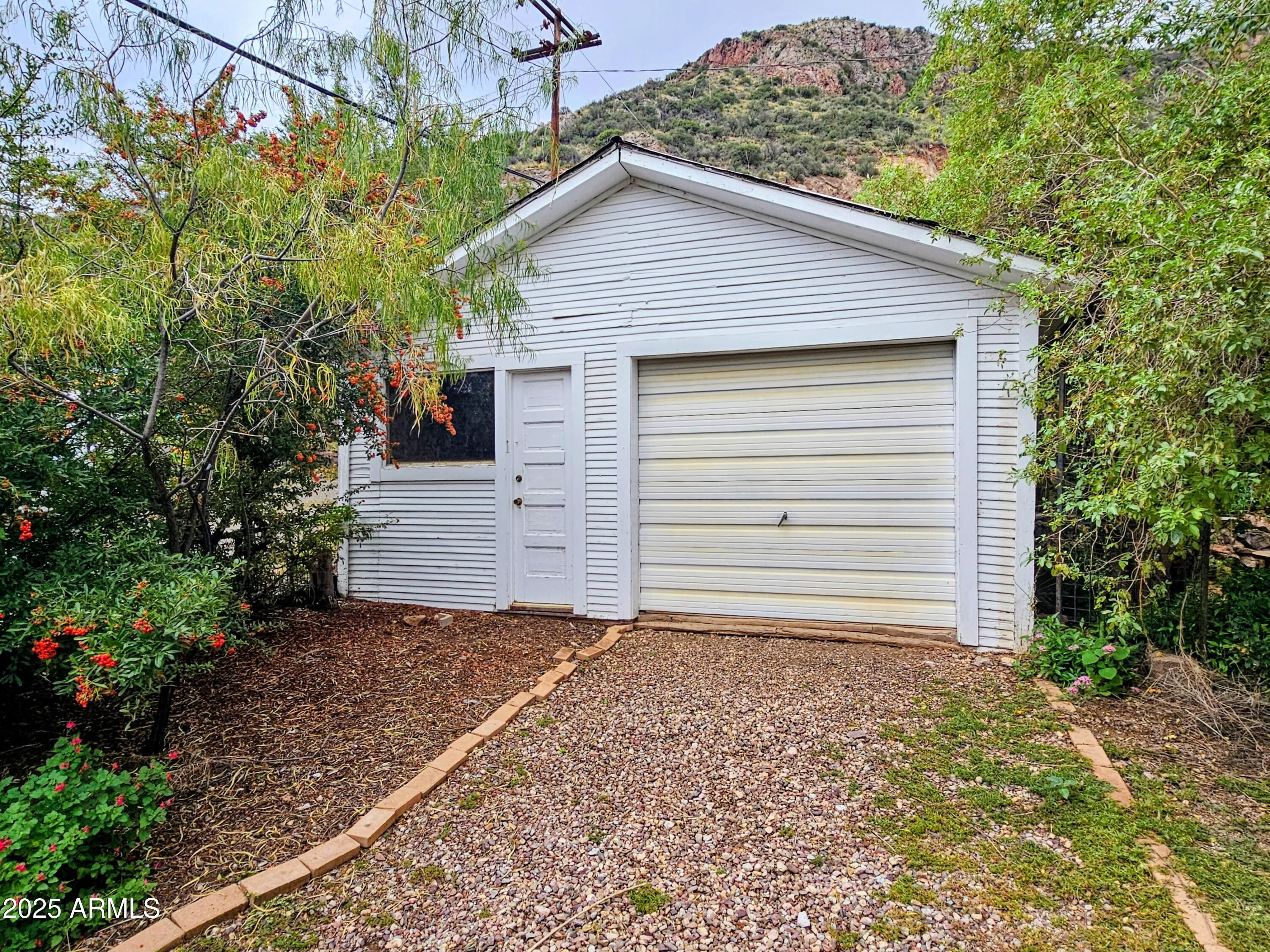 164 Quality Hill Road Bisbee, AZ 85603 - Photo 2 of 36 a view of a house with a yard