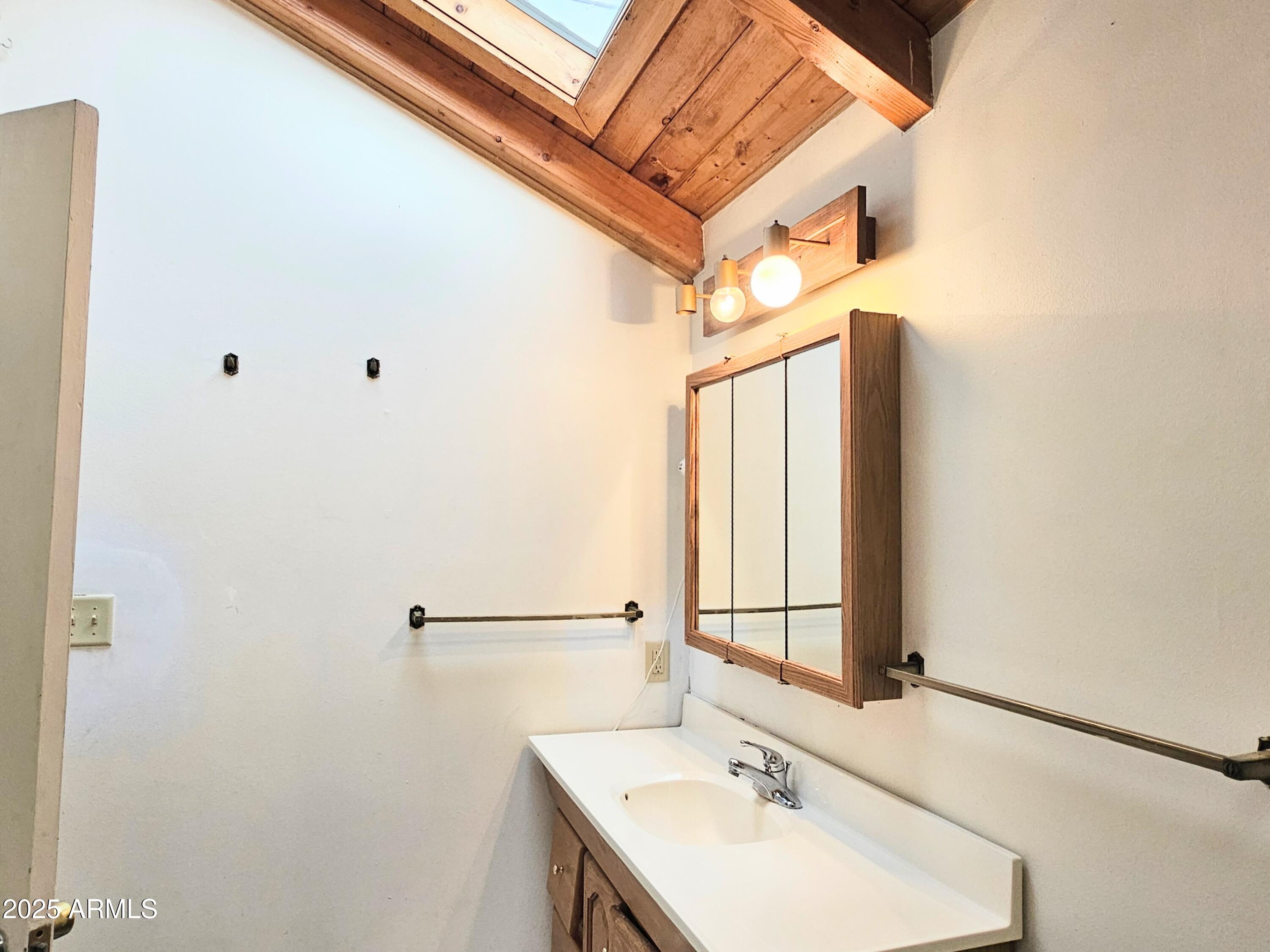 164 Quality Hill Road Bisbee, AZ 85603 - Photo 21 of 36 a bathroom with a sink and a mirror